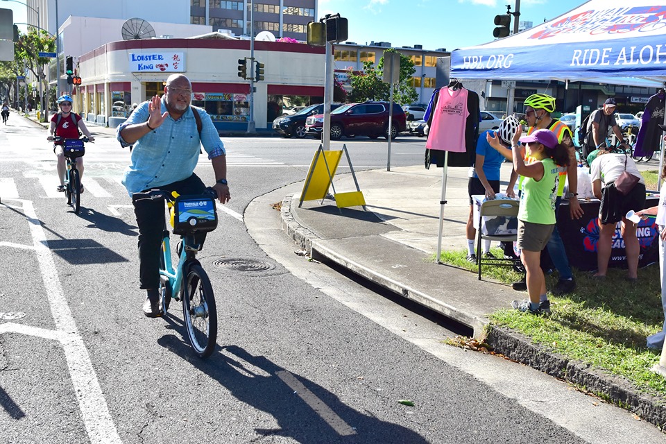 Rider Crossing Keaaumoku Street on the S King Protected Bike Path