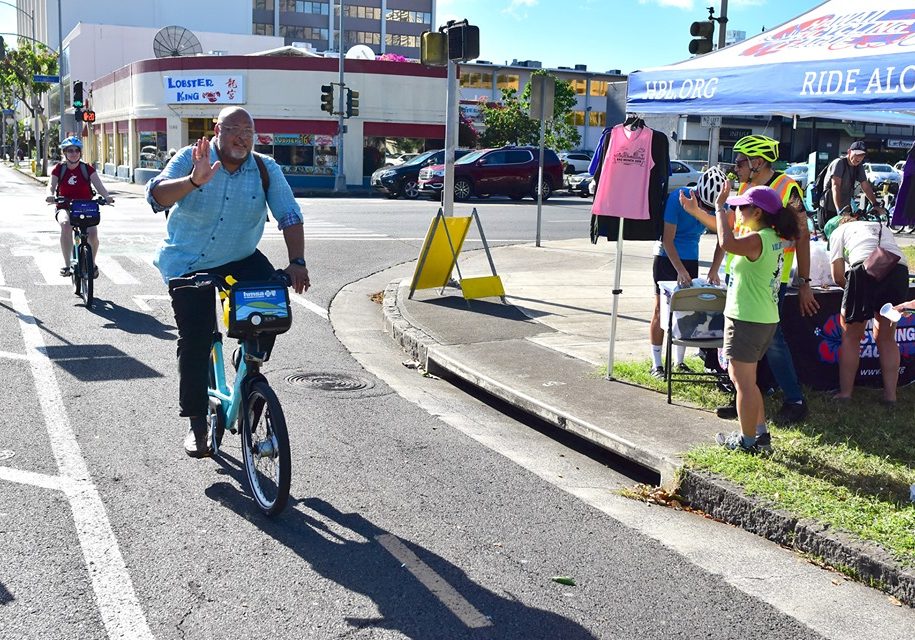 Rider Crossing Keaaumoku Street on the S King Protected Bike Path