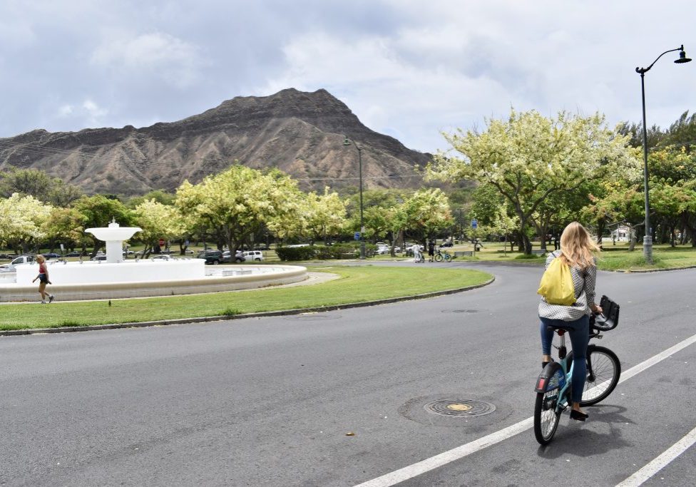 Riding on Kalakau Ave past the Louise Dillingham Memorial Fountain